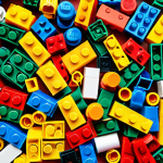 A colorful assortment of LEGO Classic bricks scattered on a table, inviting creativity and free building. This emphasizes the open-ended fun of LEGOs, perfect for a beginner.